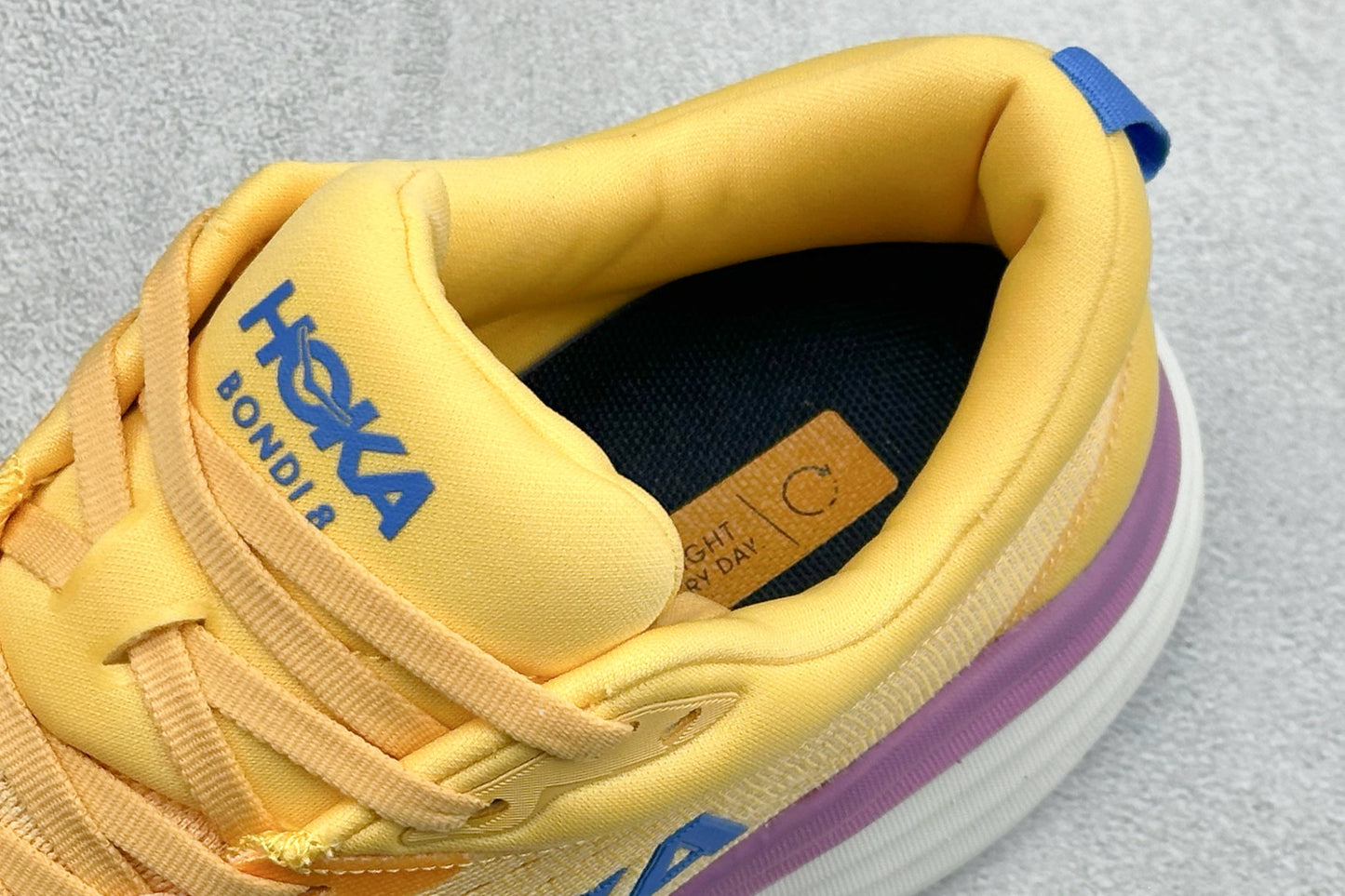 HOKA Bondi 8 Yellow Purple Gradient Blue Logo Running Shoes