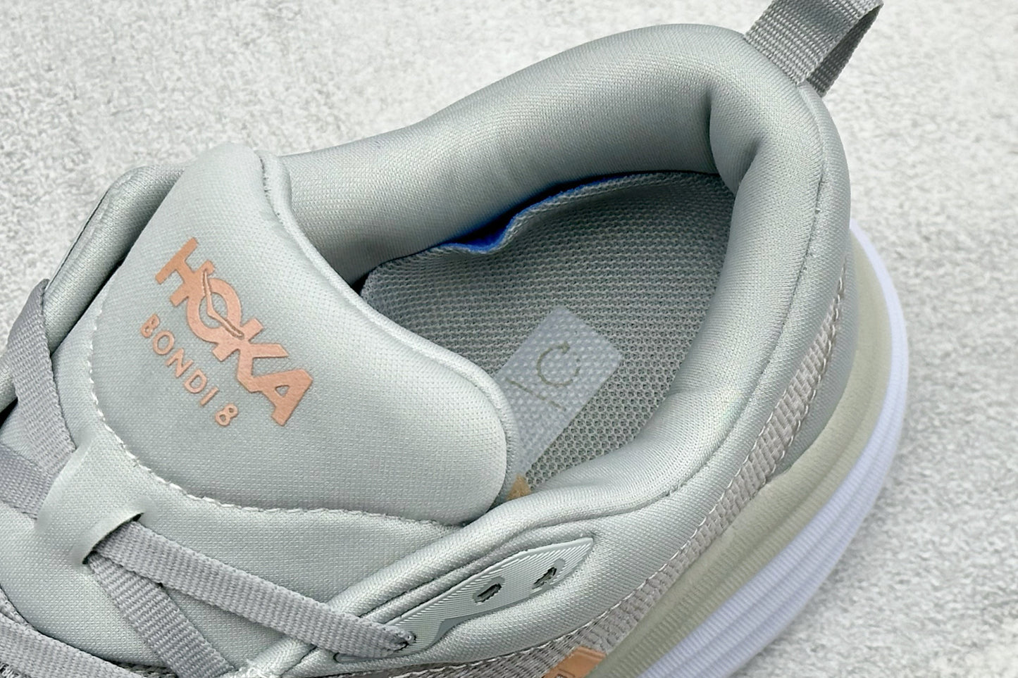 HOKA Bondi 8 Light Gray Rose Gold Logo Running Sneaker