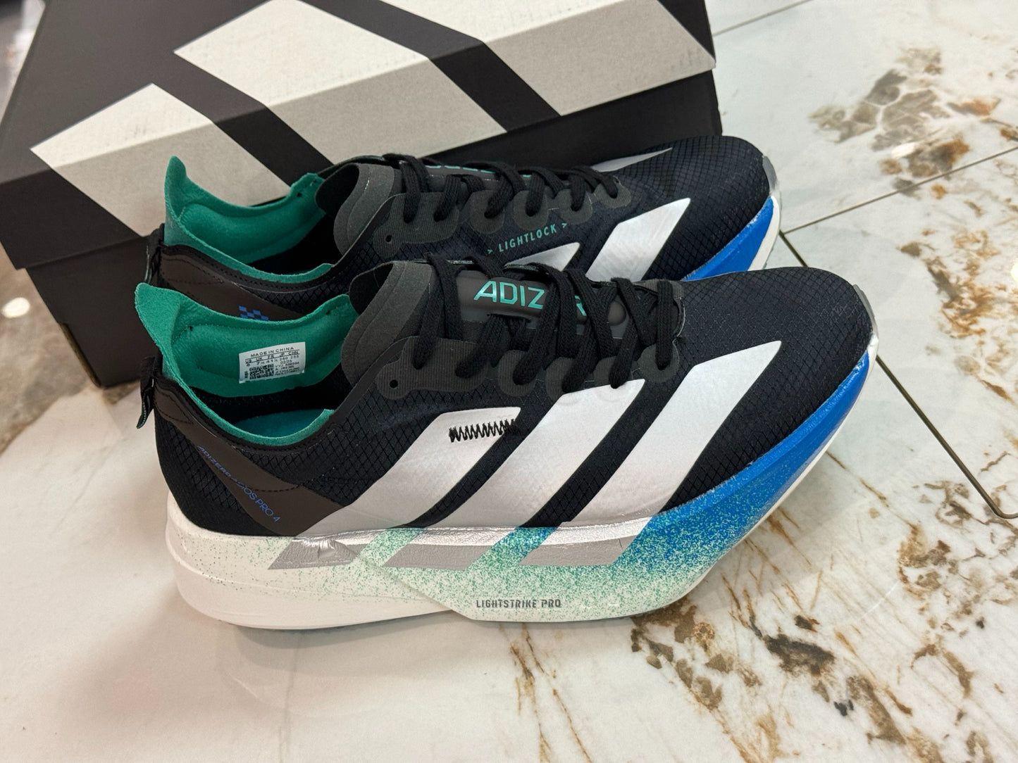 adidas Adizero Adios Pro 4 Running Shoes - Core Black / Matte Silver / Glory Green