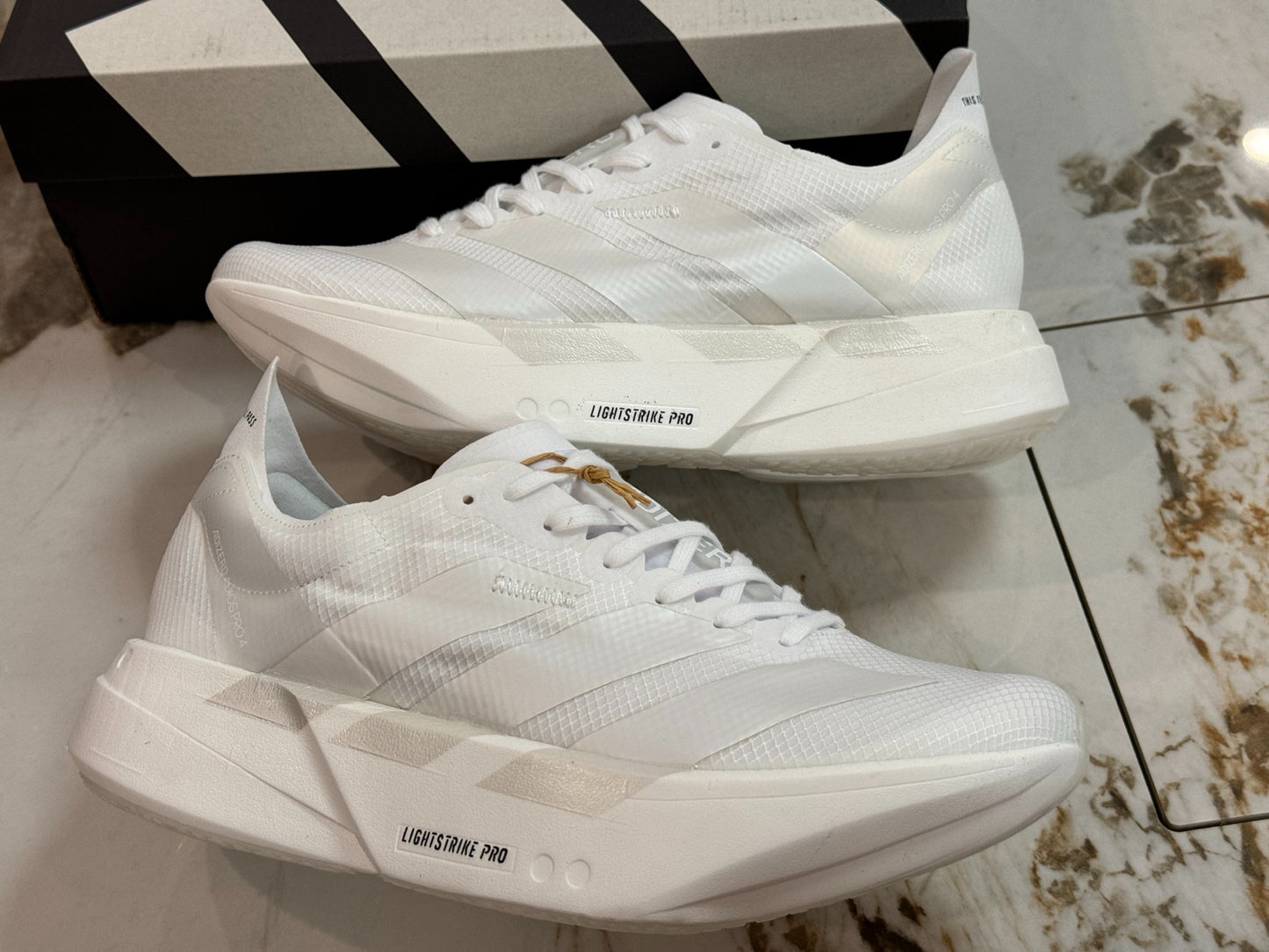 adidas Adizero Adios Pro 4 Running Shoes - Cloud White / Zero Metallic